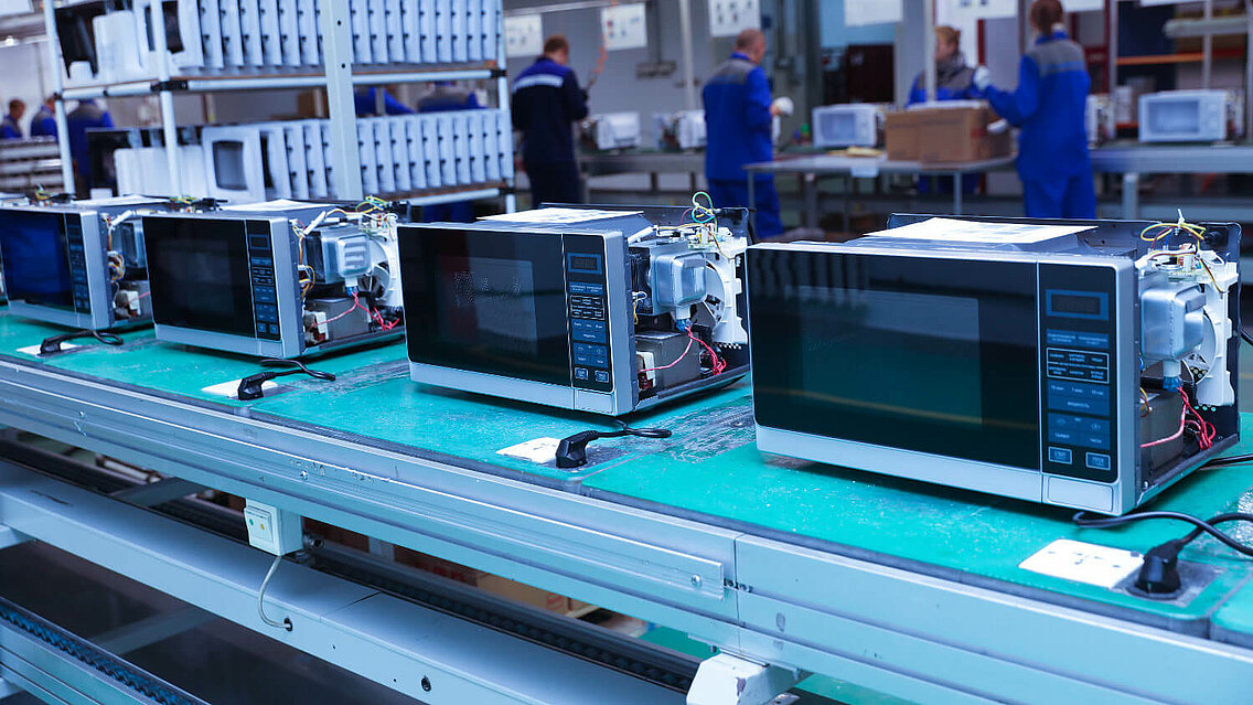 Conveyor belt of a production line for microwave ovens.