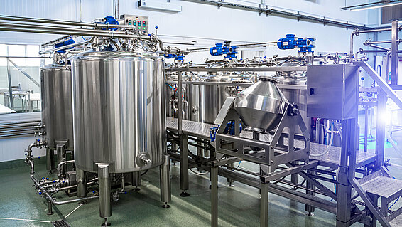 Interior of dairy factory with fermentation tank. Technology equipment at dairy farm. Sterile production.