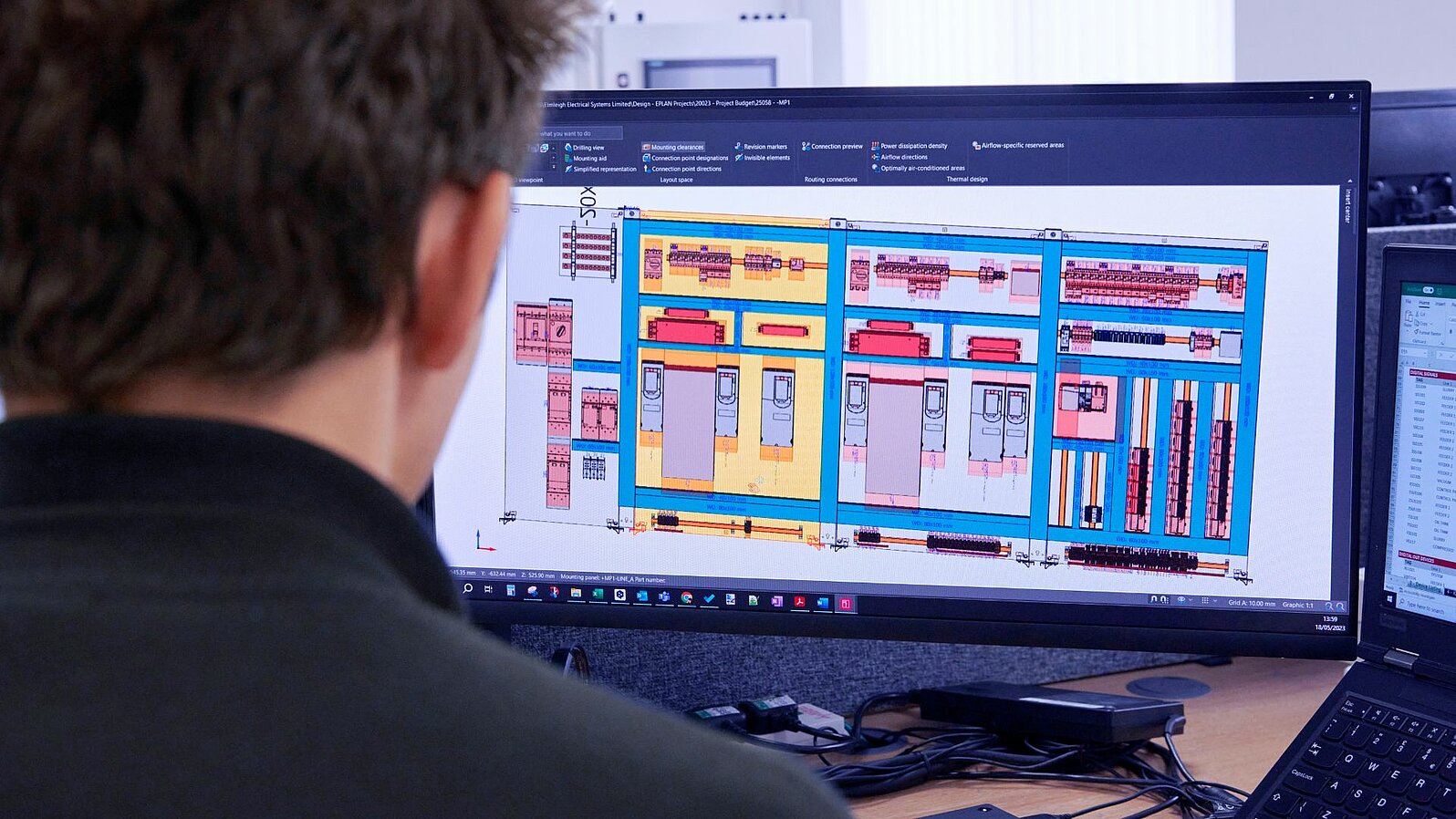 An employee planning automation solutions on the computer.